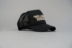 Load image into Gallery viewer, Staple Logo Millionaire Essentials Black Trucker Hat
